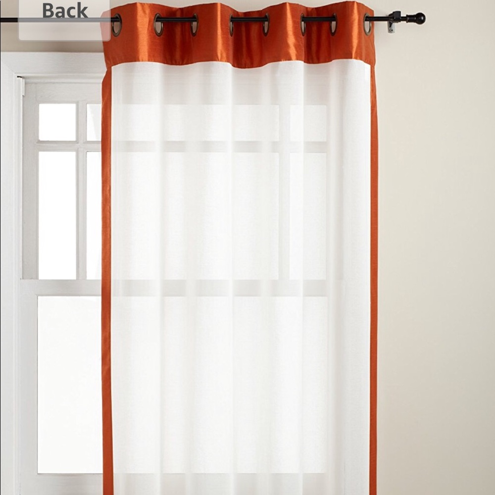 Two SOHO grommet panel sheer curtains